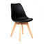Silla Catarina con asiento tapizado en vinipiel, concha de polipropileno y patas de madera de haya